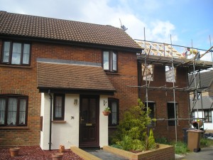 Front of property with extension in progress to the right